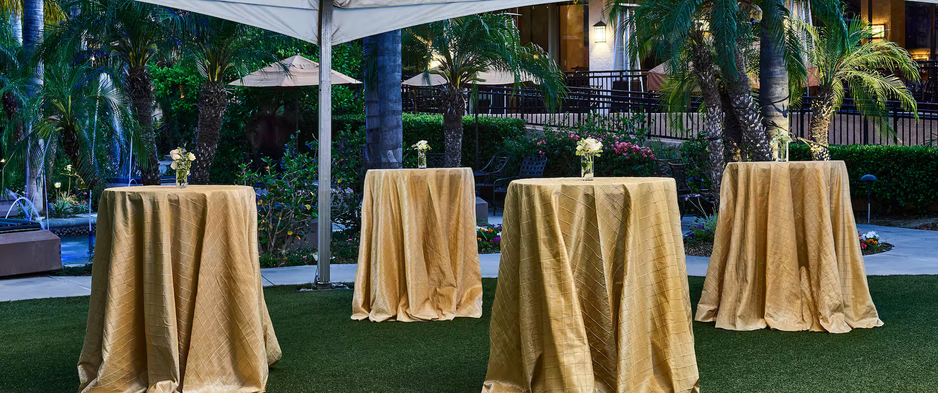 Outdoor networking area with cocktail tables