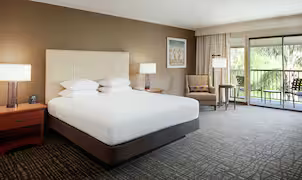 Spacious king guestroom with a private balcony