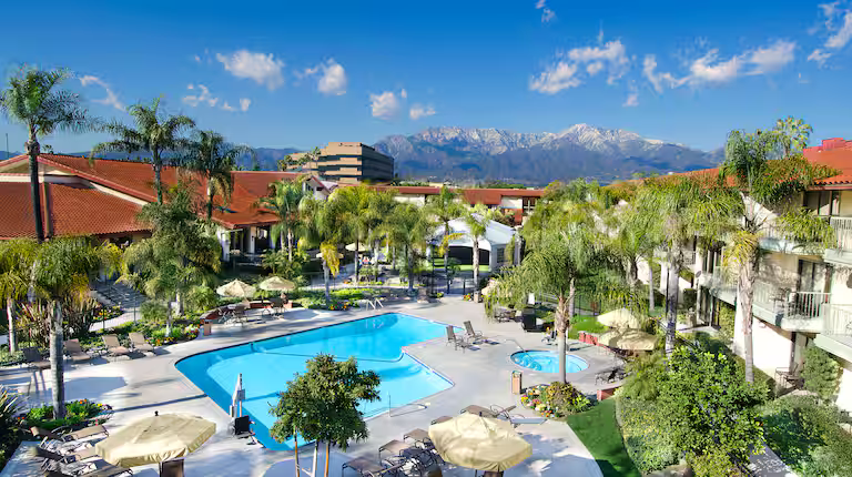 DoubleTree Ontario Airport outdoor pool surrounded by palm trees